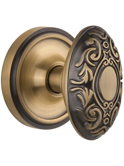 Classic Rosette Door Set With Decorative Oval Knobs Single Dummy in Antique Brass.